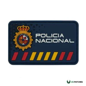 Parche Policía Nacional España PVC azul con escudo oficial y franjas rojas.